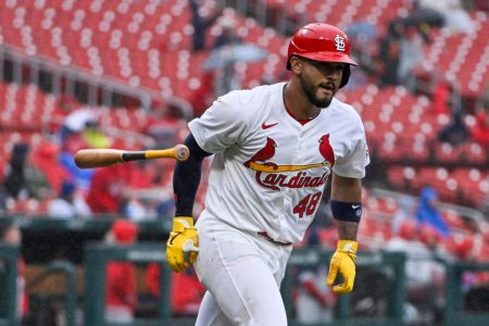 Ivan Herrera flips his bat after a home run